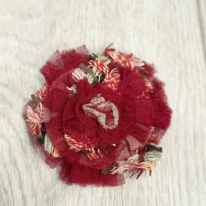 Chanel Camellia brooch in beige pink and brown.